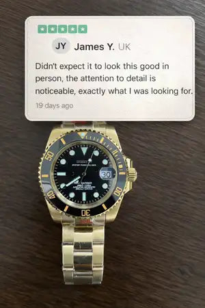 Gold-tone stainless steel rolex submariner watch with a black dial and blue bezel.